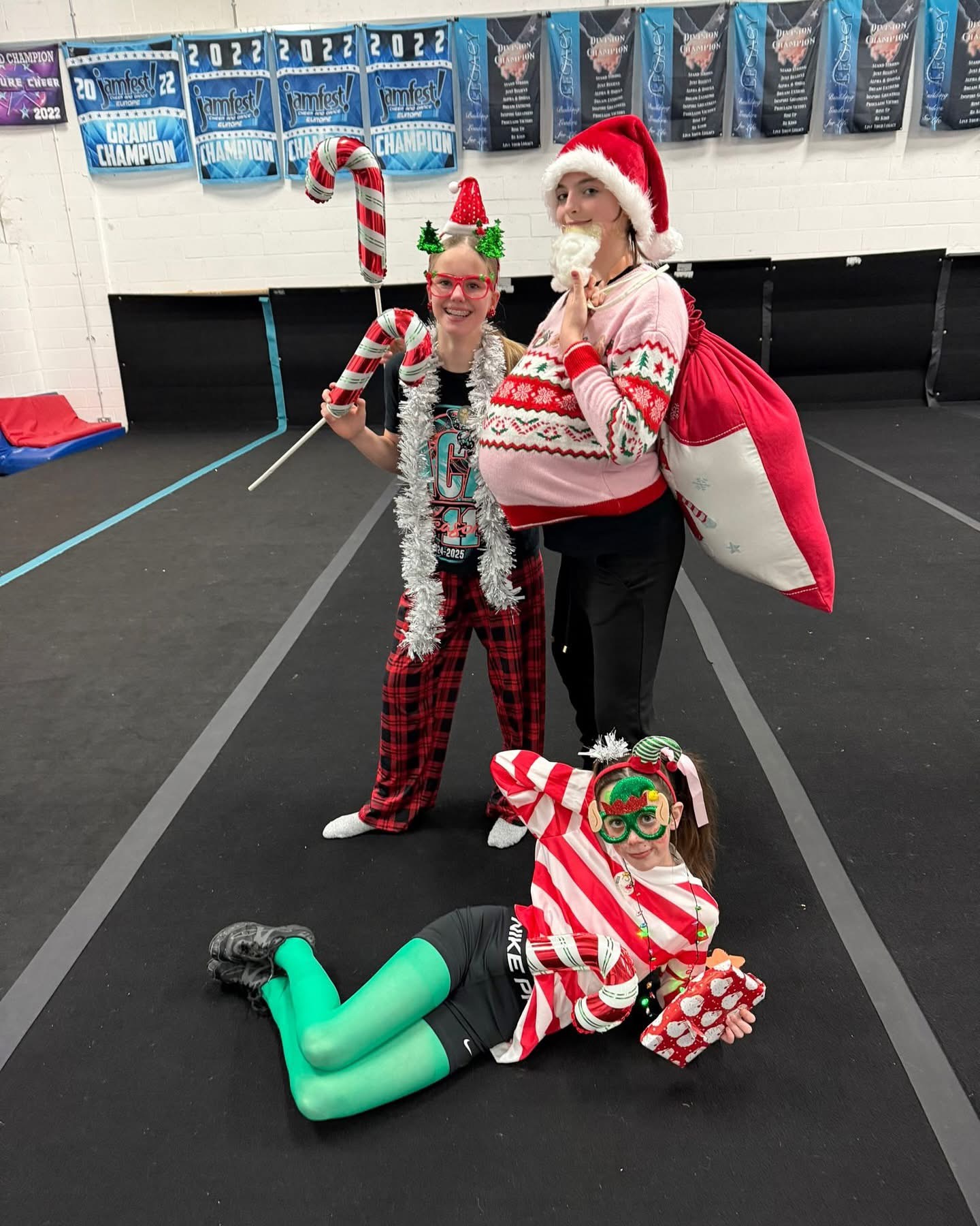 ACA cheerleaders in festive costumes at a party in the gym